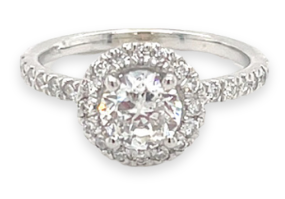 large diamond engagement ring on pink background